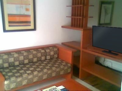 Lounge with sofa, TV cabinet and coffee table